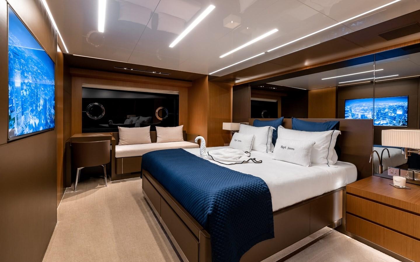 a room with a bed and a tv aboard RAPH SEVEN II Yacht for Sale