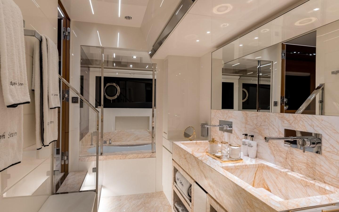a bathroom with a sink and a mirror aboard RAPH SEVEN II Yacht for Sale