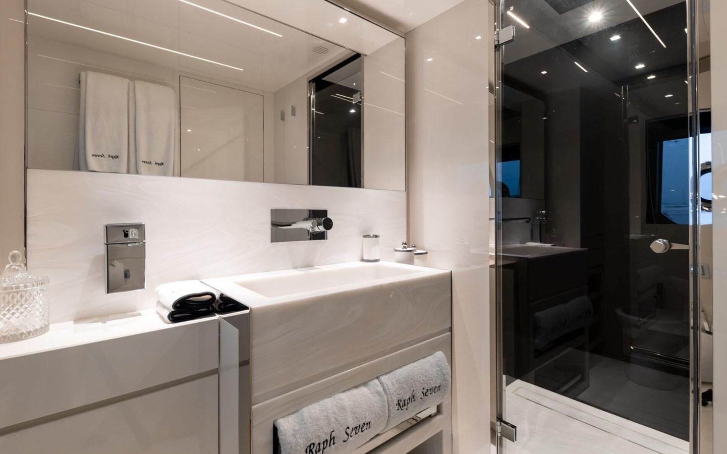 a bathroom with a large mirror aboard RAPH SEVEN II Yacht for Sale