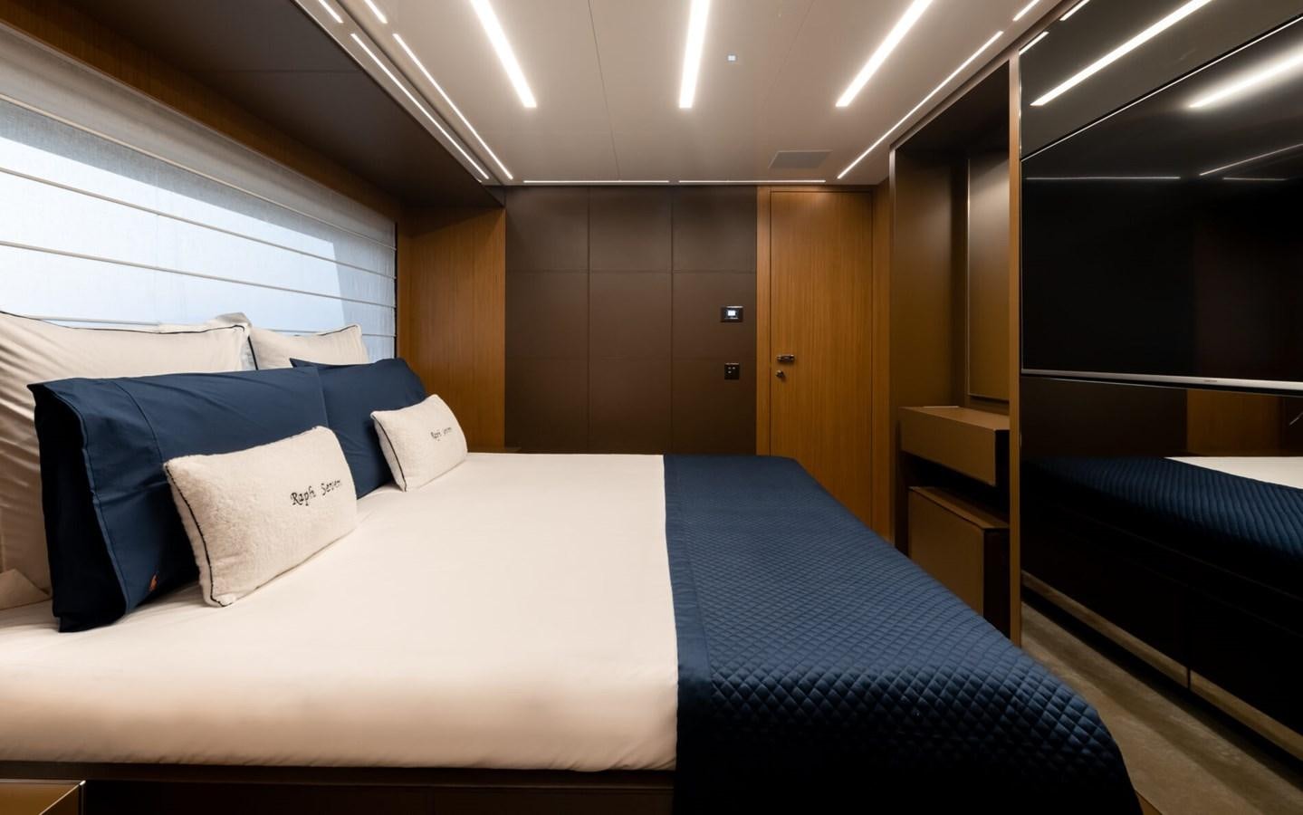 a room with a bed and a desk aboard RAPH SEVEN II Yacht for Sale