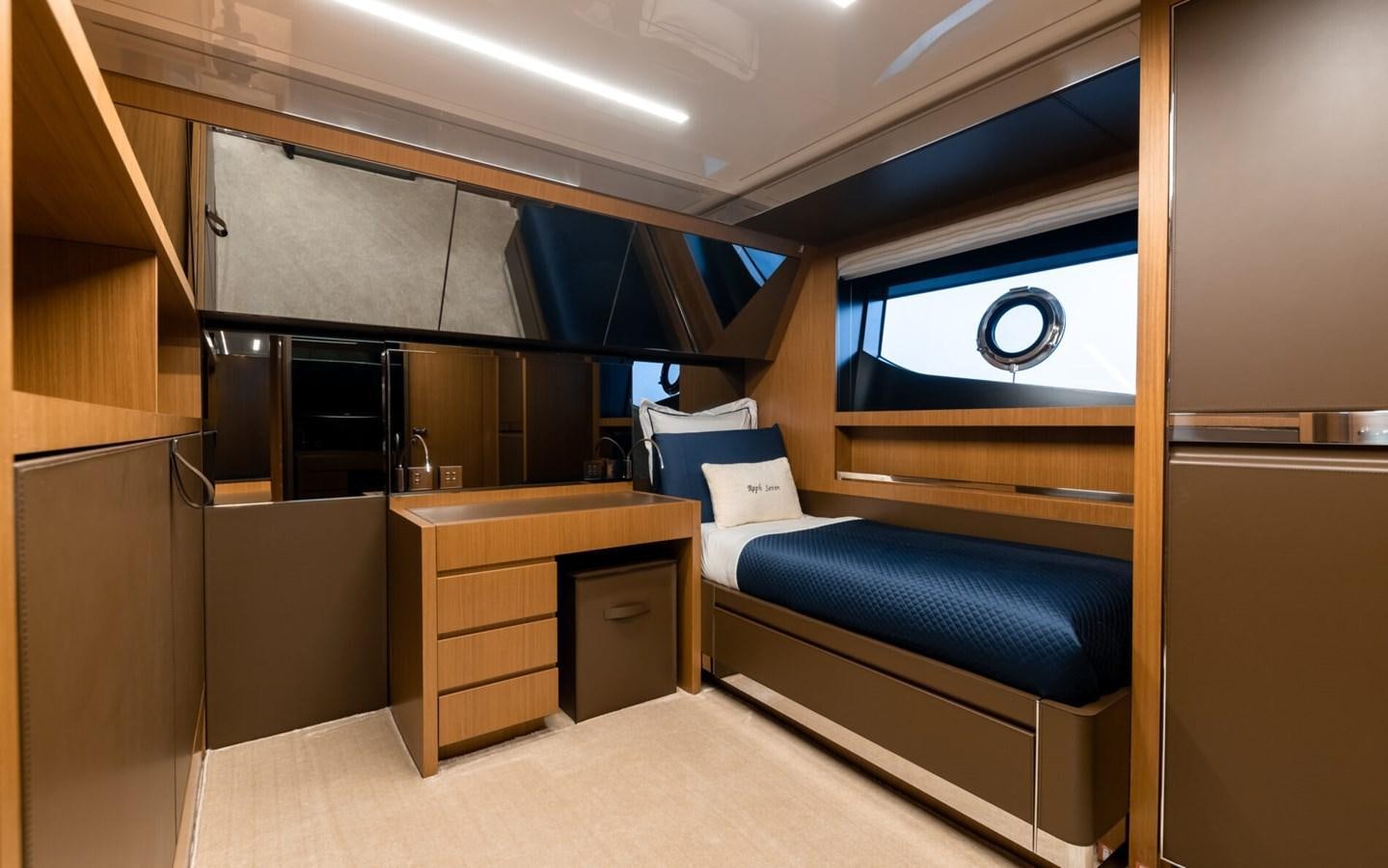 a room with a bed and a desk aboard RAPH SEVEN II Yacht for Sale