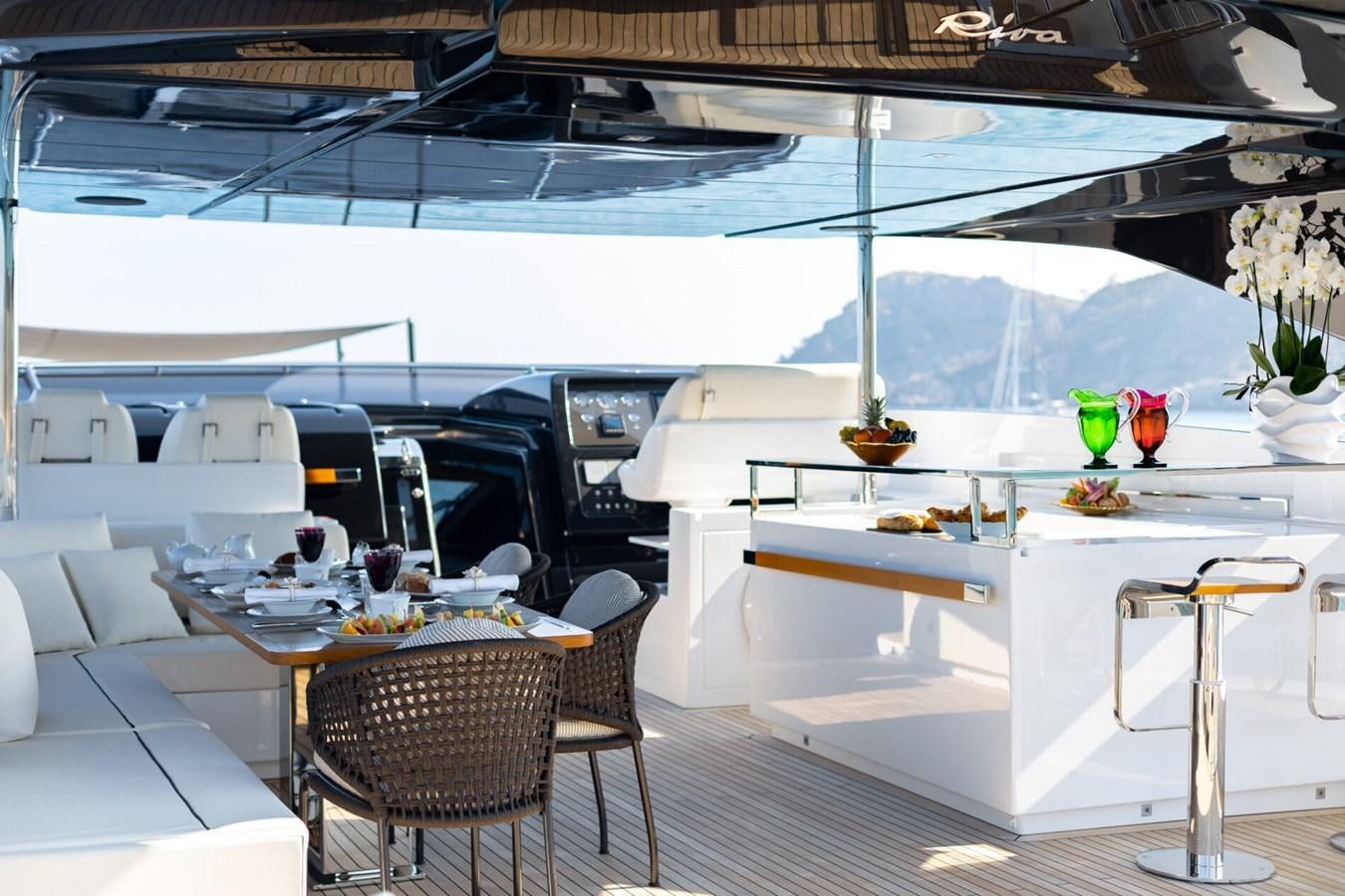 a boat with tables and chairs aboard RAPH SEVEN II Yacht for Sale