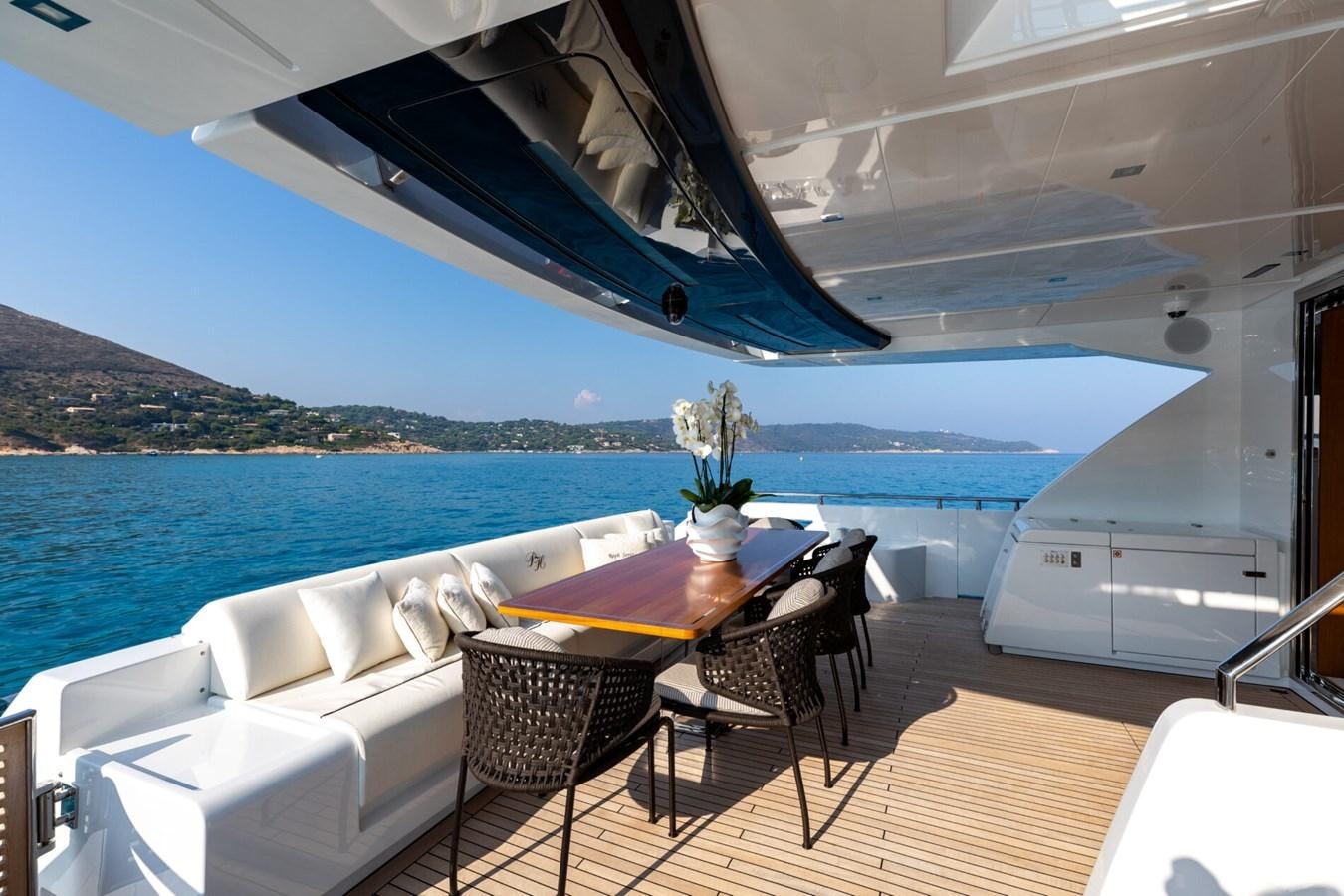 a table and chairs on a boat aboard RAPH SEVEN II Yacht for Sale