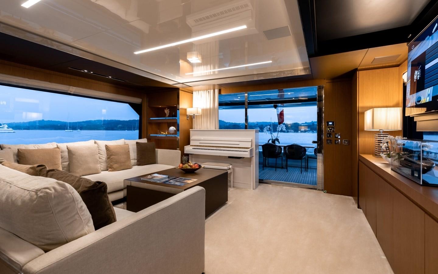 a living room with a large window aboard RAPH SEVEN II Yacht for Sale
