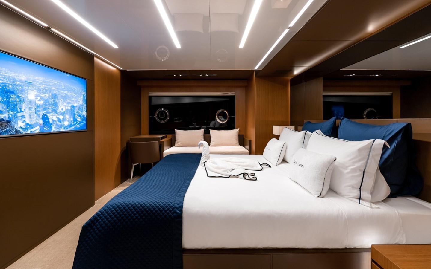 a room with a bed and a tv aboard RAPH SEVEN II Yacht for Sale