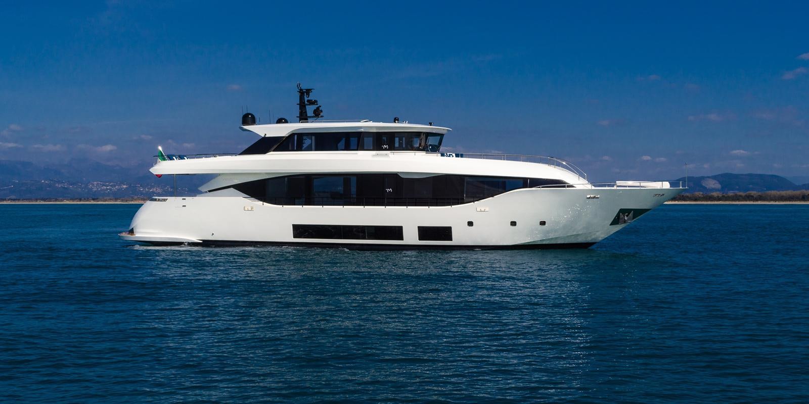 a white yacht in the water aboard ZOUT Yacht for Sale