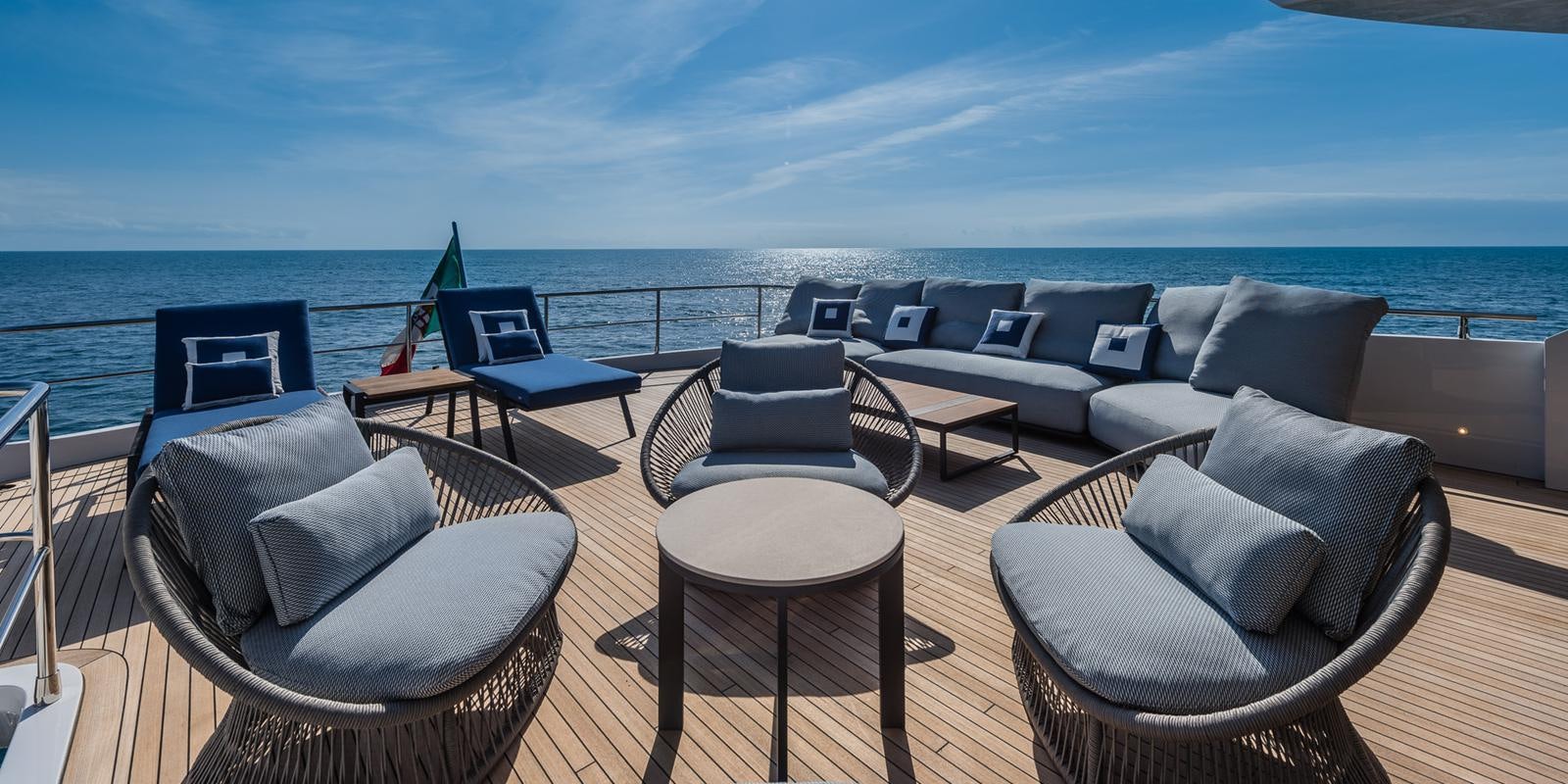 a living room with a large balcony aboard ZOUT Yacht for Sale