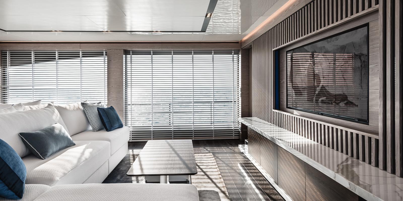 a room with a couch and a television aboard ZOUT Yacht for Sale