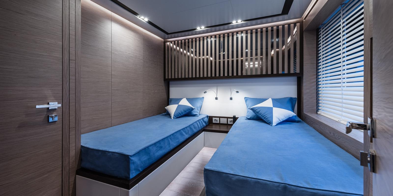 a room with two beds aboard ZOUT Yacht for Sale