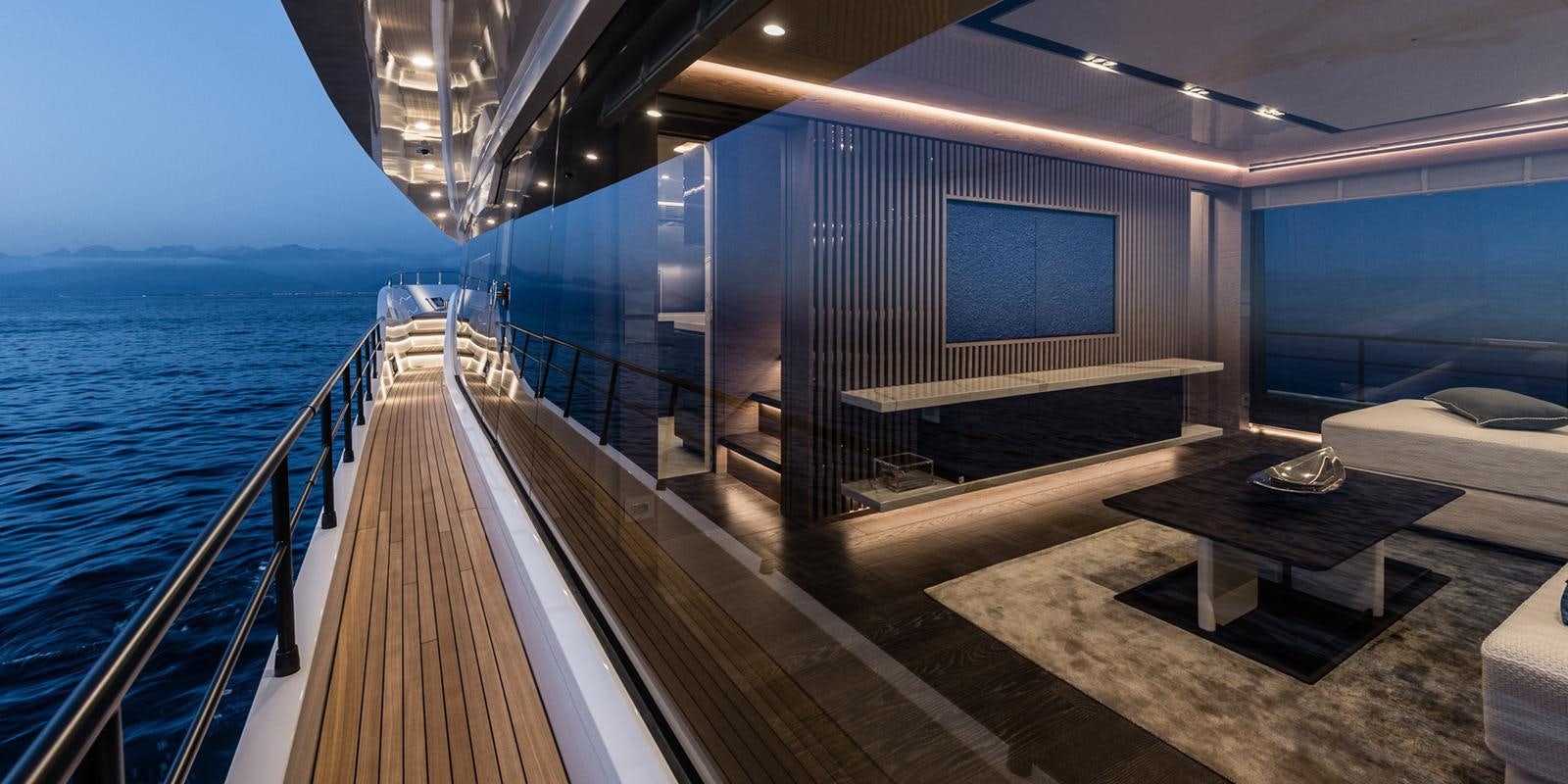 a deck with a view of the ocean and a large television screen aboard ZOUT Yacht for Sale