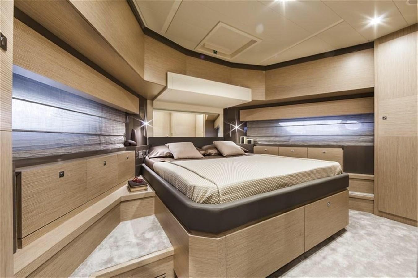 a room with a bed and a window aboard AMO Yacht for Sale