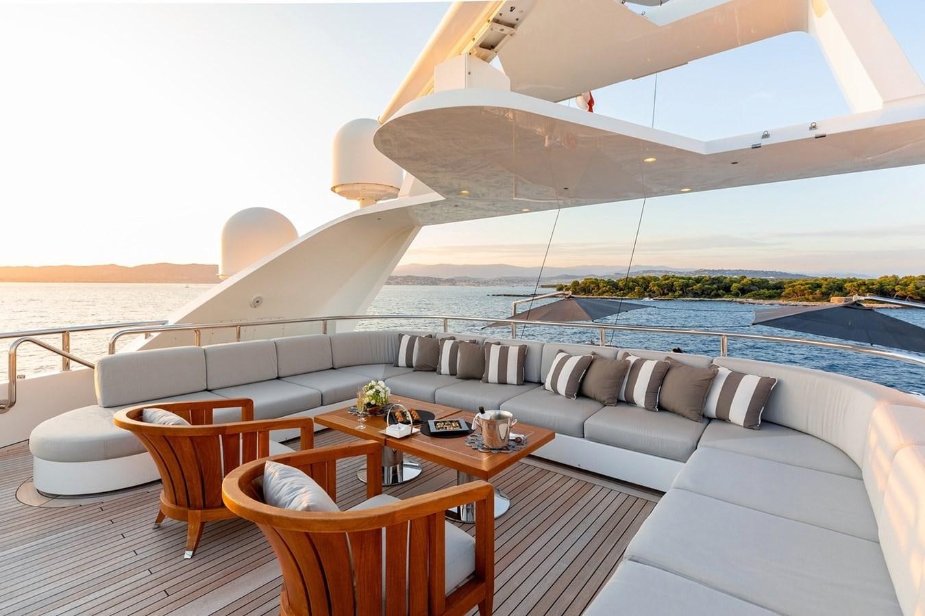 a living room with a large sofa aboard SEANNA Yacht for Sale