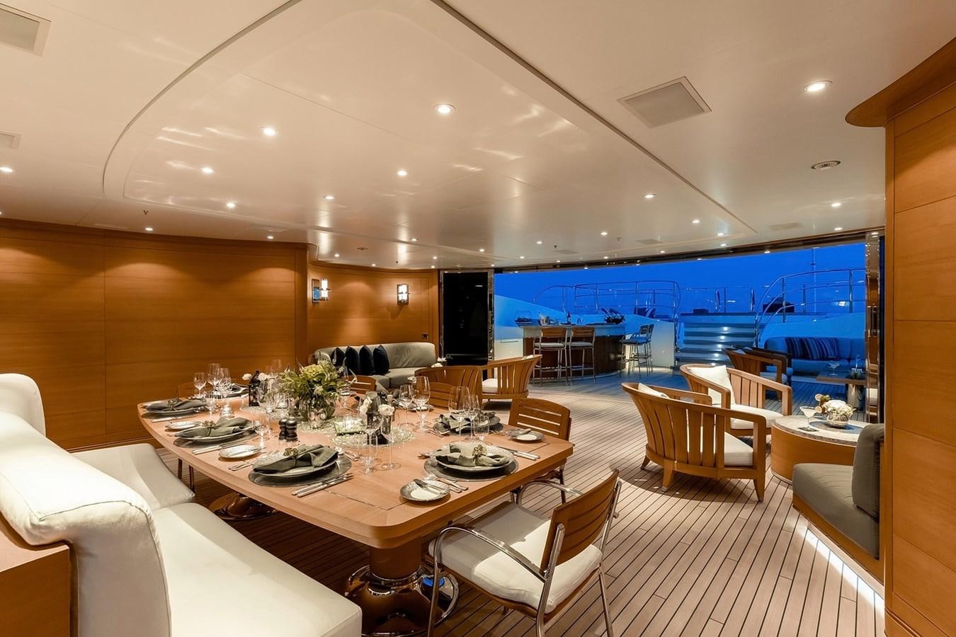 a large room with tables and chairs aboard SEANNA Yacht for Sale