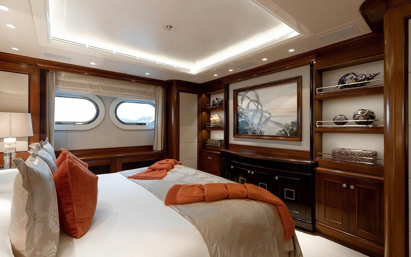 a bedroom with a large mirror aboard SEANNA Yacht for Sale
