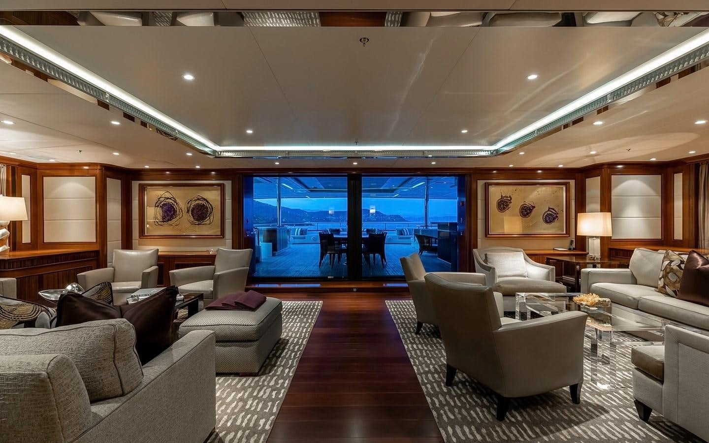 a living room with a large window aboard SEANNA Yacht for Sale