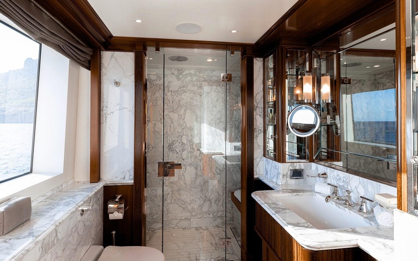 a bathroom with a large mirror aboard SEANNA Yacht for Sale