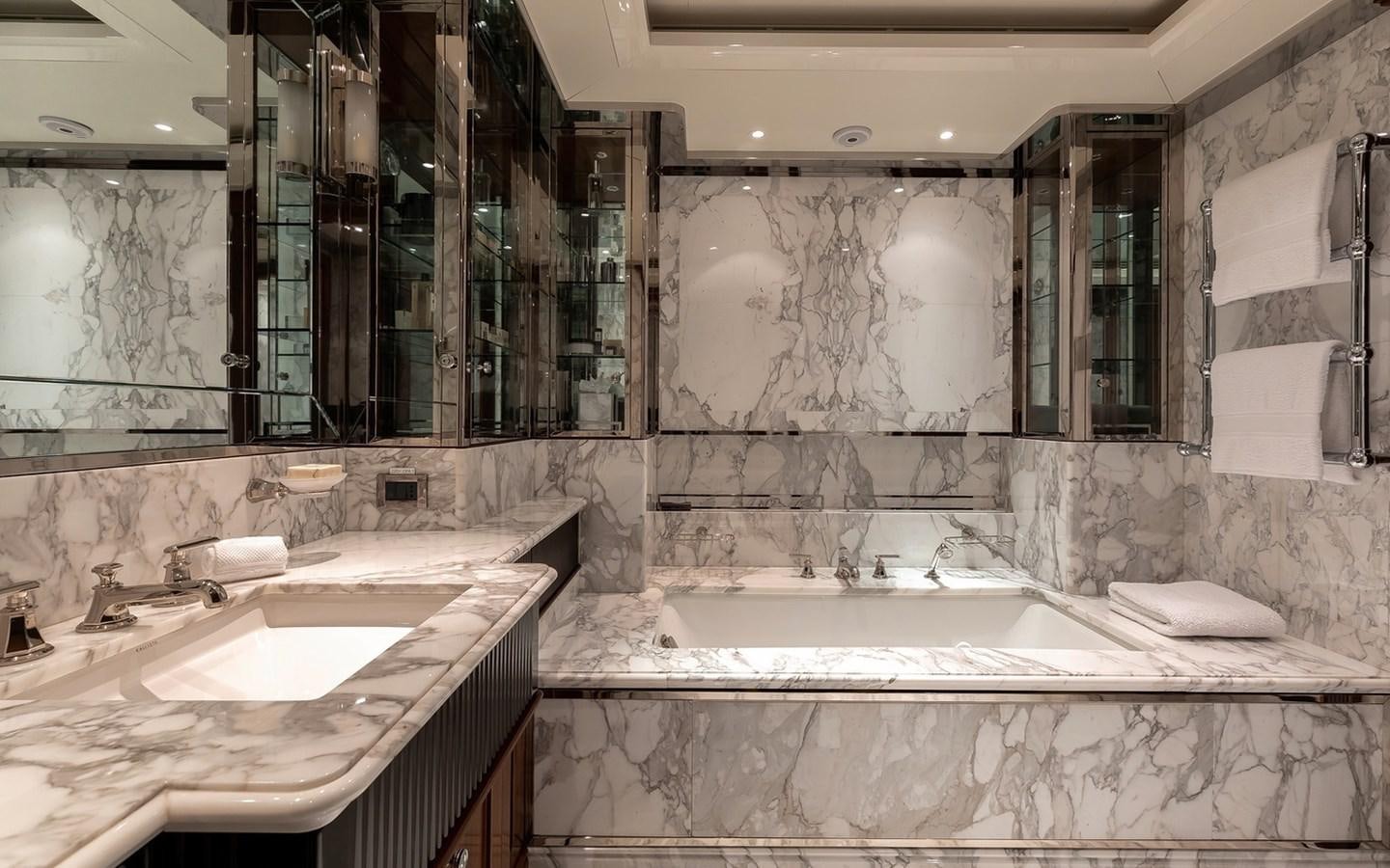 a bathroom with a large bathtub aboard SEANNA Yacht for Sale