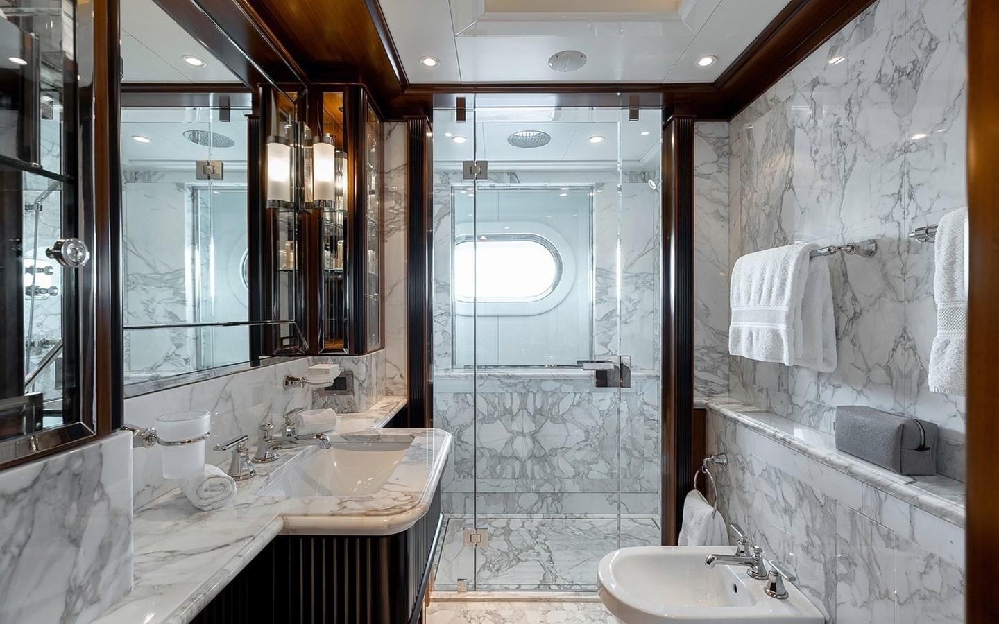 a bathroom with a glass shower aboard SEANNA Yacht for Sale