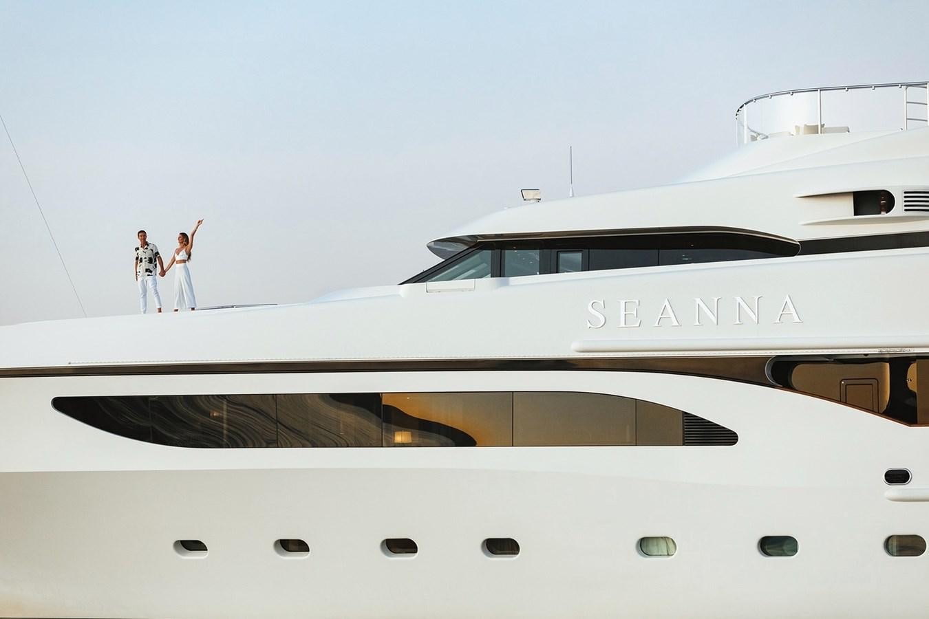 a couple of people standing on a yacht aboard SEANNA Yacht for Sale