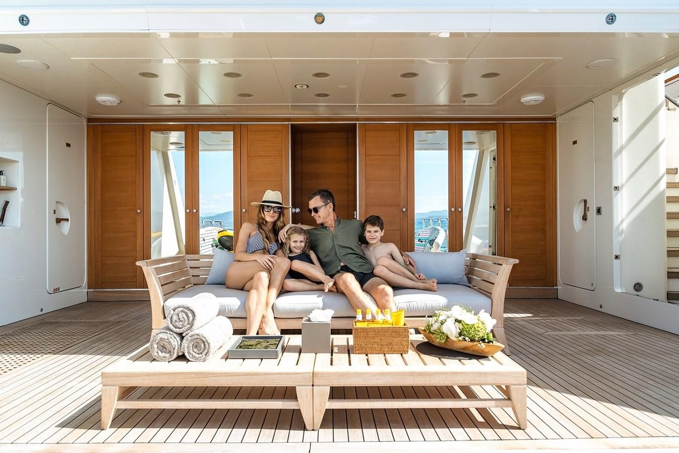 a group of people sitting on a couch aboard SEANNA Yacht for Sale