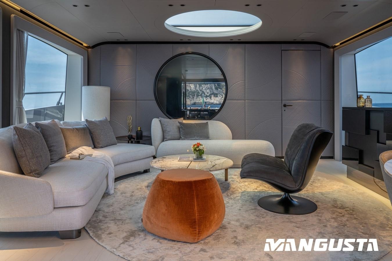 a living room with a couch and a coffee table aboard OURS Yacht for Sale