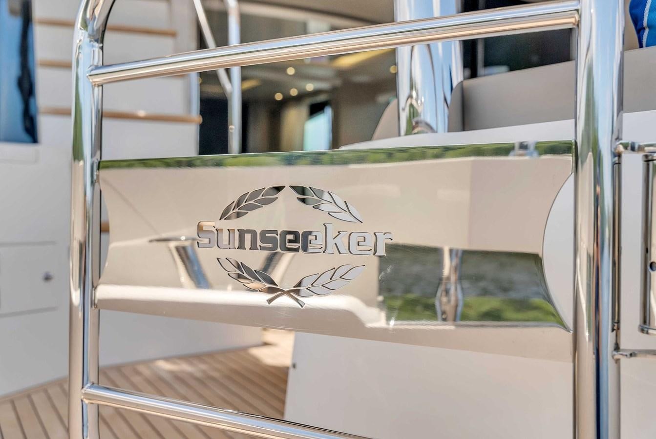 a sign on a metal railing aboard 86 Yacht for Sale