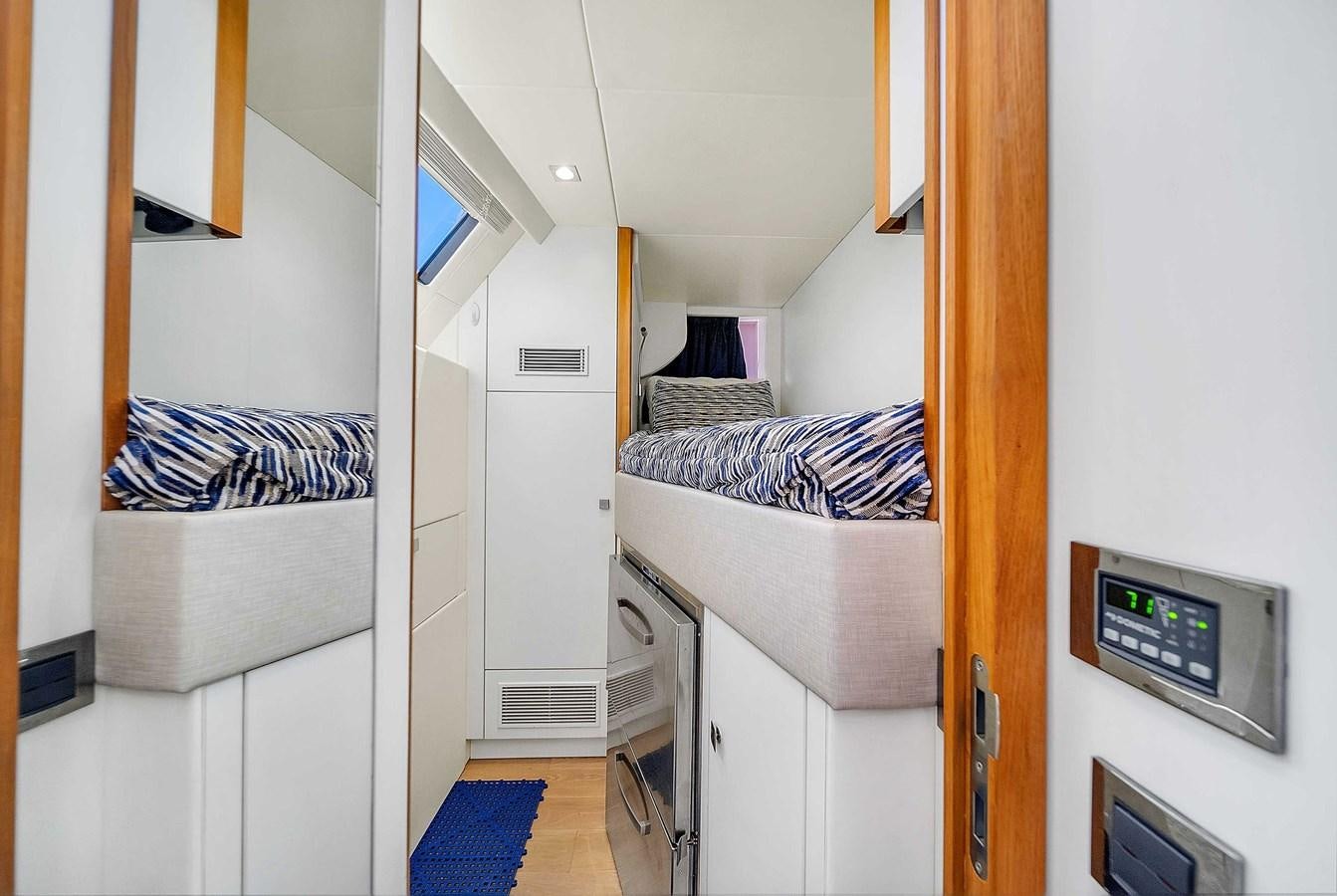 a room with a bed and a desk aboard 86 Yacht for Sale