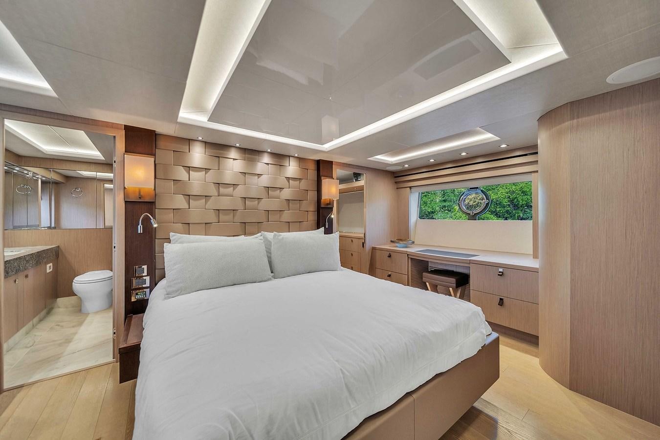 a bedroom with a large bed aboard 86 Yacht for Sale