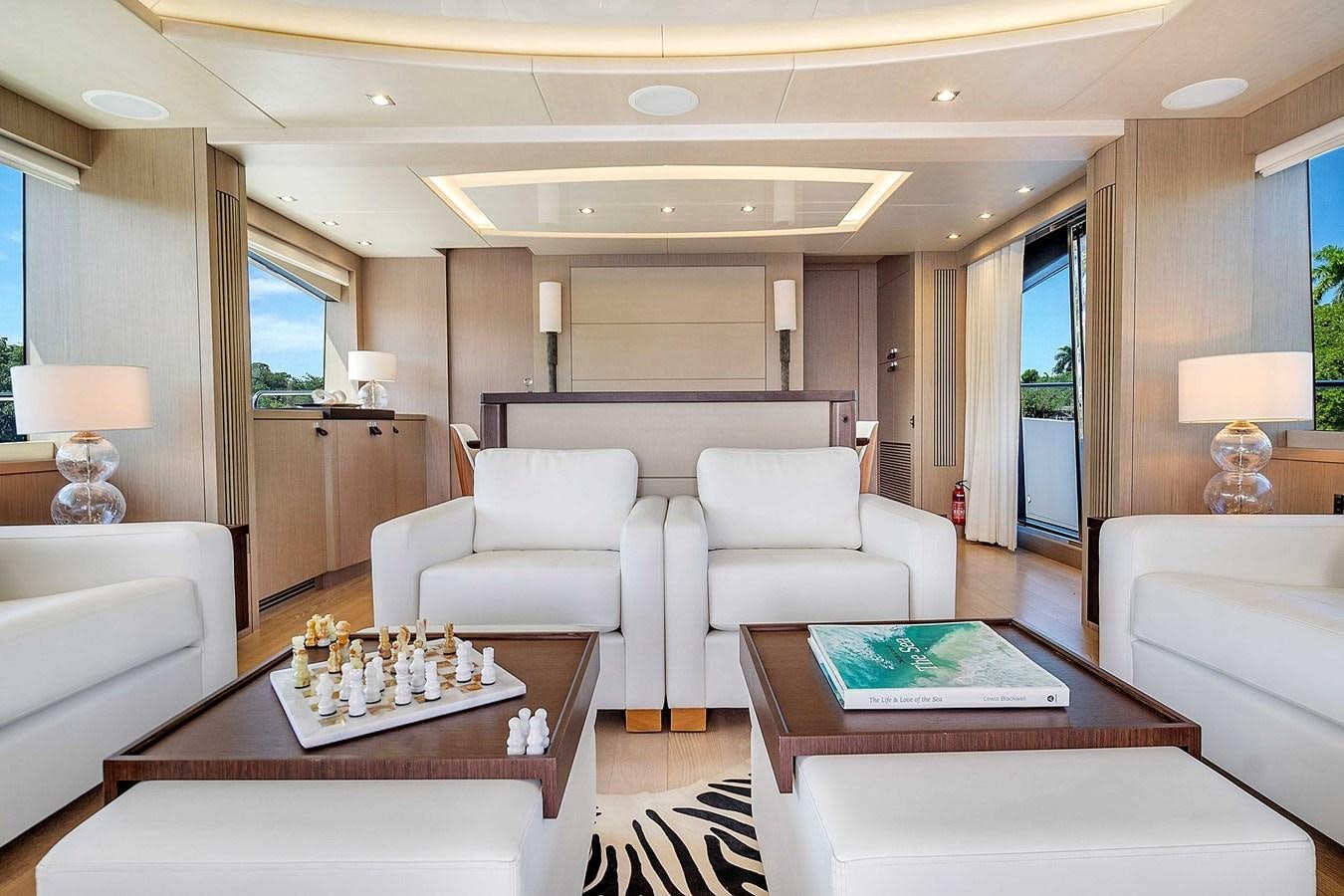 a living room with a table and chairs aboard 86 Yacht for Sale