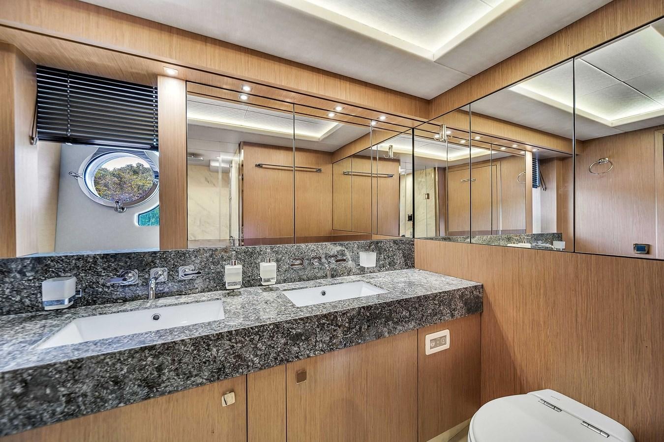 a bathroom with a large mirror aboard 86 Yacht for Sale