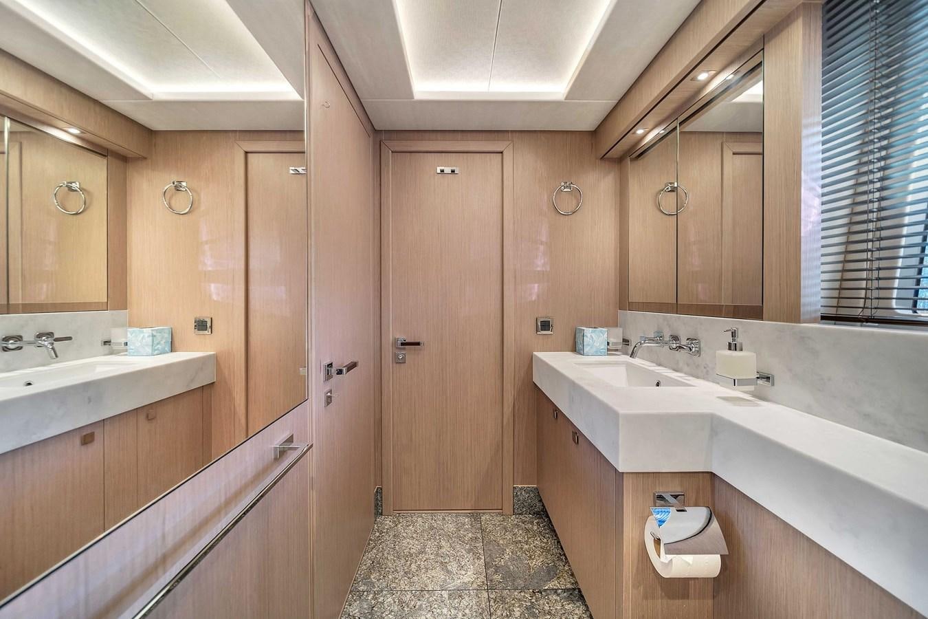 a bathroom with two sinks aboard 86 Yacht for Sale