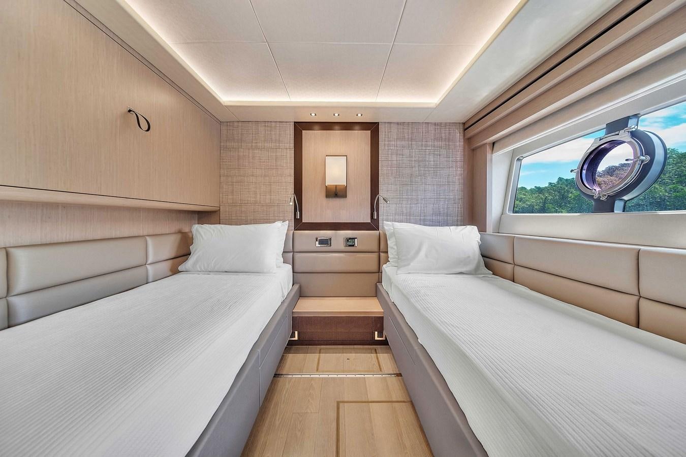 a room with two beds aboard 86 Yacht for Sale