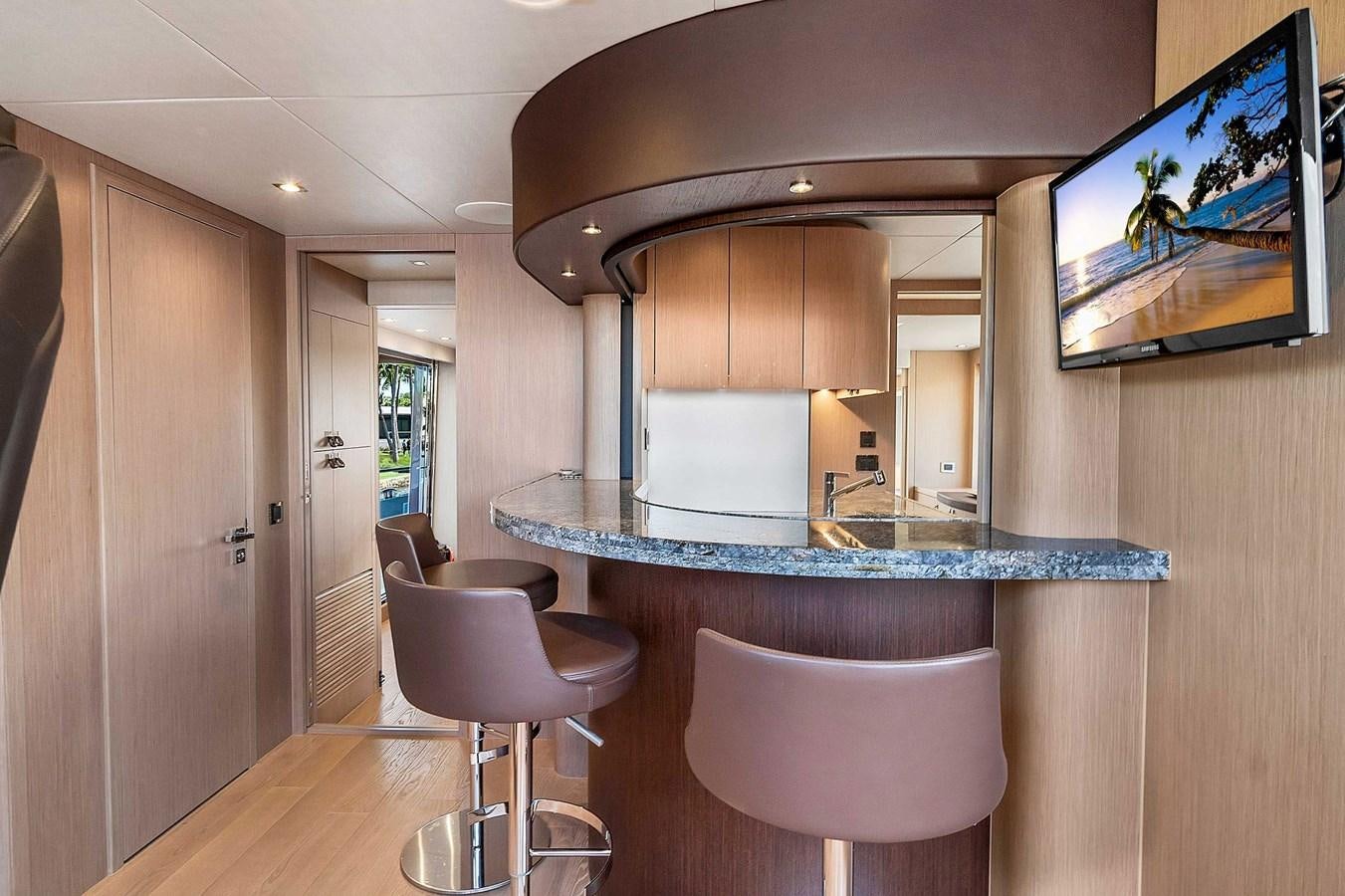 a kitchen with a table and chairs aboard 86 Yacht for Sale