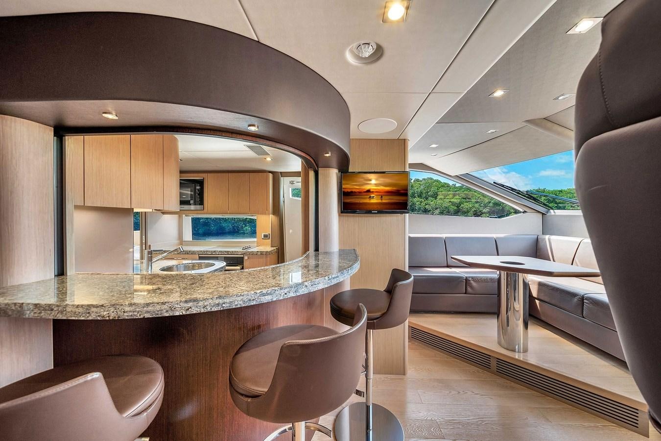 a room with a table and chairs aboard 86 Yacht for Sale
