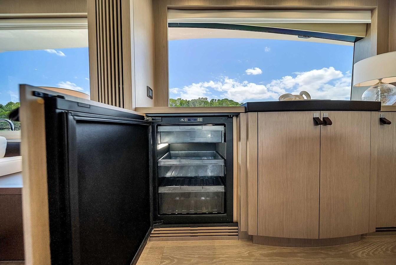 a kitchen with a large window aboard 86 Yacht for Sale