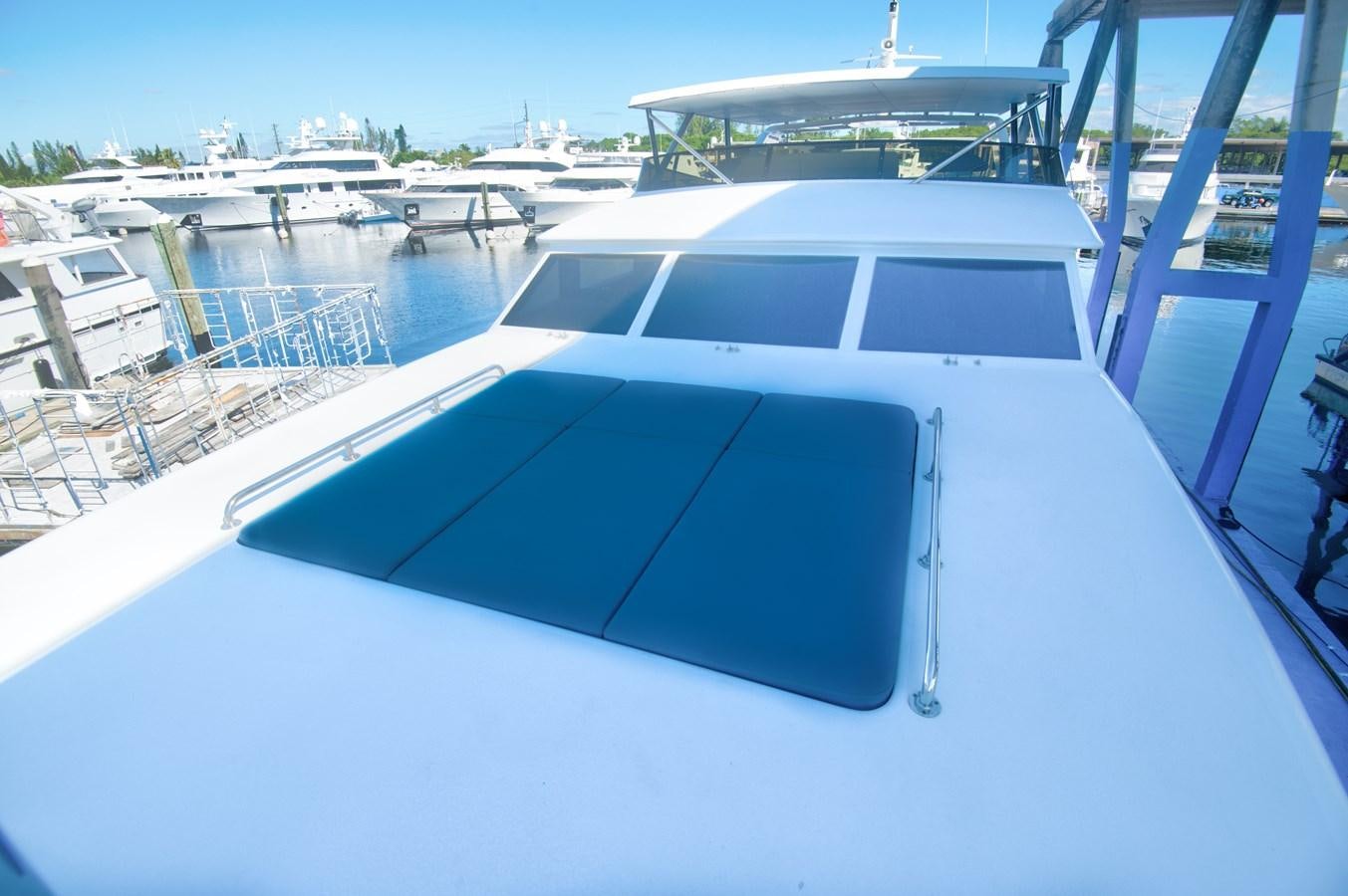a white yacht on a dock aboard DESLIZE Yacht for Sale