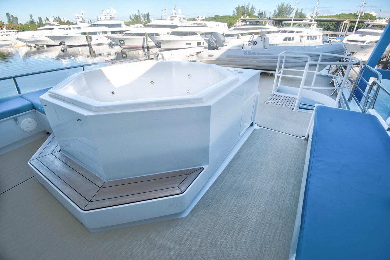 a white boat on a dock aboard DESLIZE Yacht for Sale