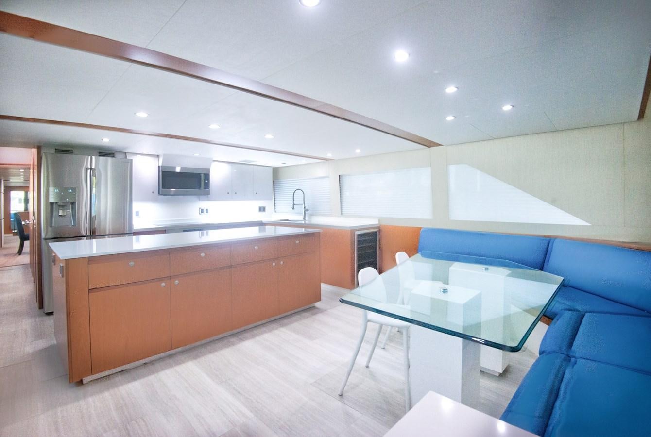 a kitchen with a table and chairs aboard DESLIZE Yacht for Sale