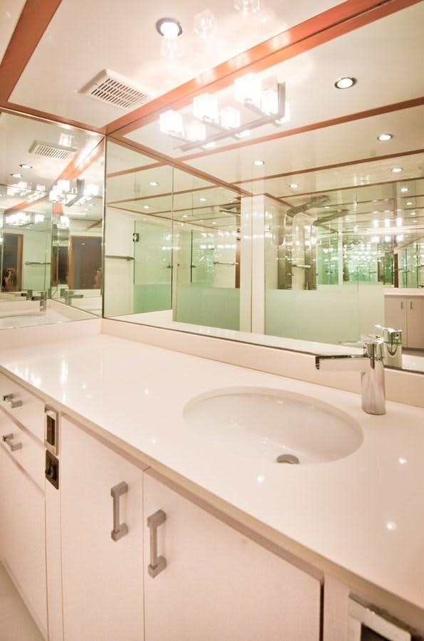 a bathroom with a large mirror aboard DESLIZE Yacht for Sale