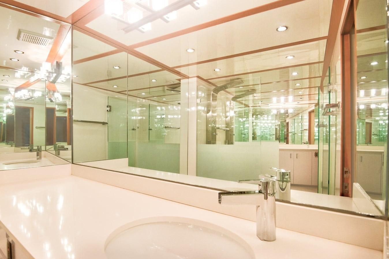 a large bathroom with a large mirror aboard DESLIZE Yacht for Sale