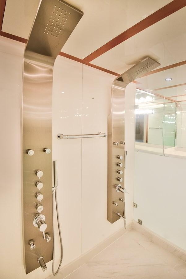 a bathroom with a large mirror aboard DESLIZE Yacht for Sale