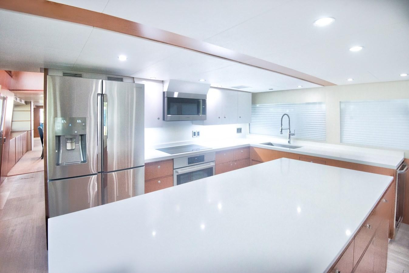 a kitchen with a large island aboard DESLIZE Yacht for Sale
