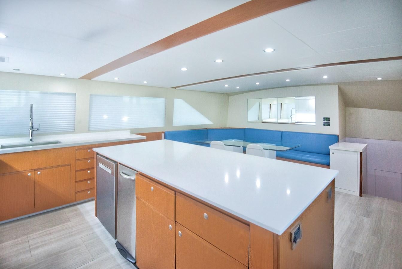 a kitchen with a large island aboard DESLIZE Yacht for Sale