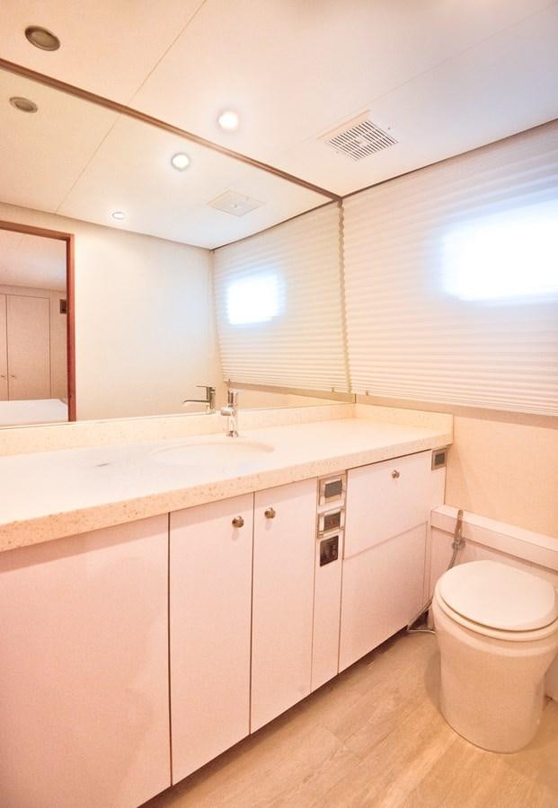 a bathroom with a toilet and sink aboard DESLIZE Yacht for Sale