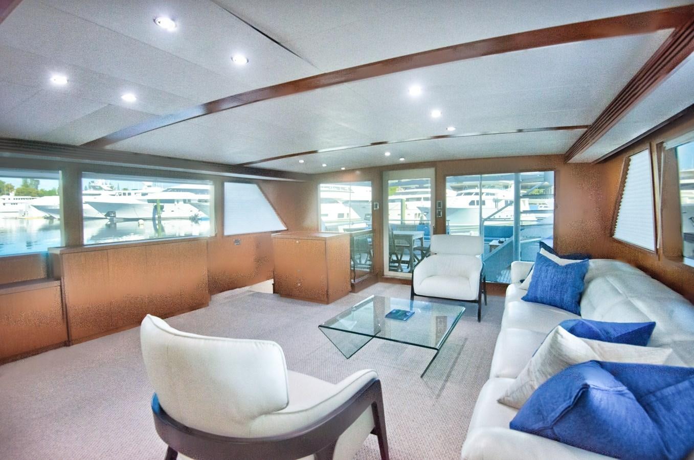 a living room with a large window aboard DESLIZE Yacht for Sale