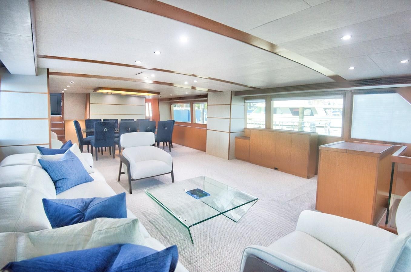a room with a couch and a table and chairs aboard DESLIZE Yacht for Sale