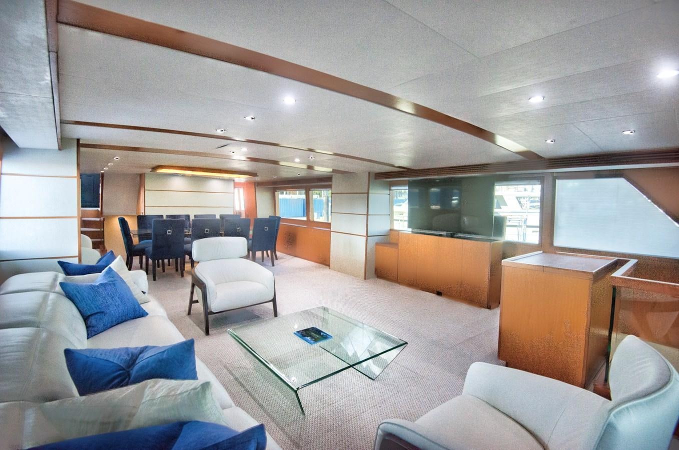 a room with a couch and a table and chairs aboard DESLIZE Yacht for Sale