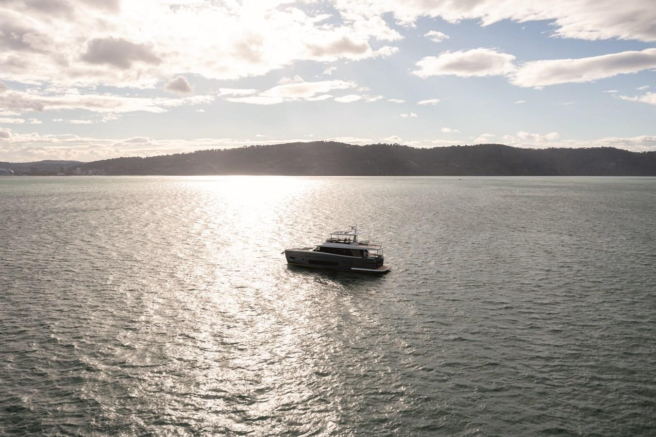 a boat on the water aboard 2023 MAGELLANO 66 Yacht for Sale