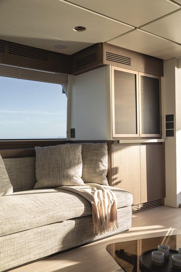 a couch in a room aboard 2023 MAGELLANO 66 Yacht for Sale