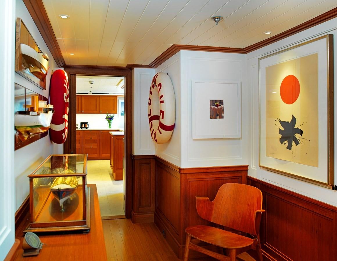 a room with a table and chairs aboard MESERRET II Yacht for Sale